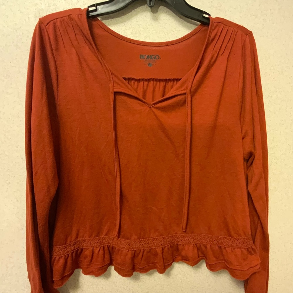 Bongo burnt orange long sleeve ruffle bottom top